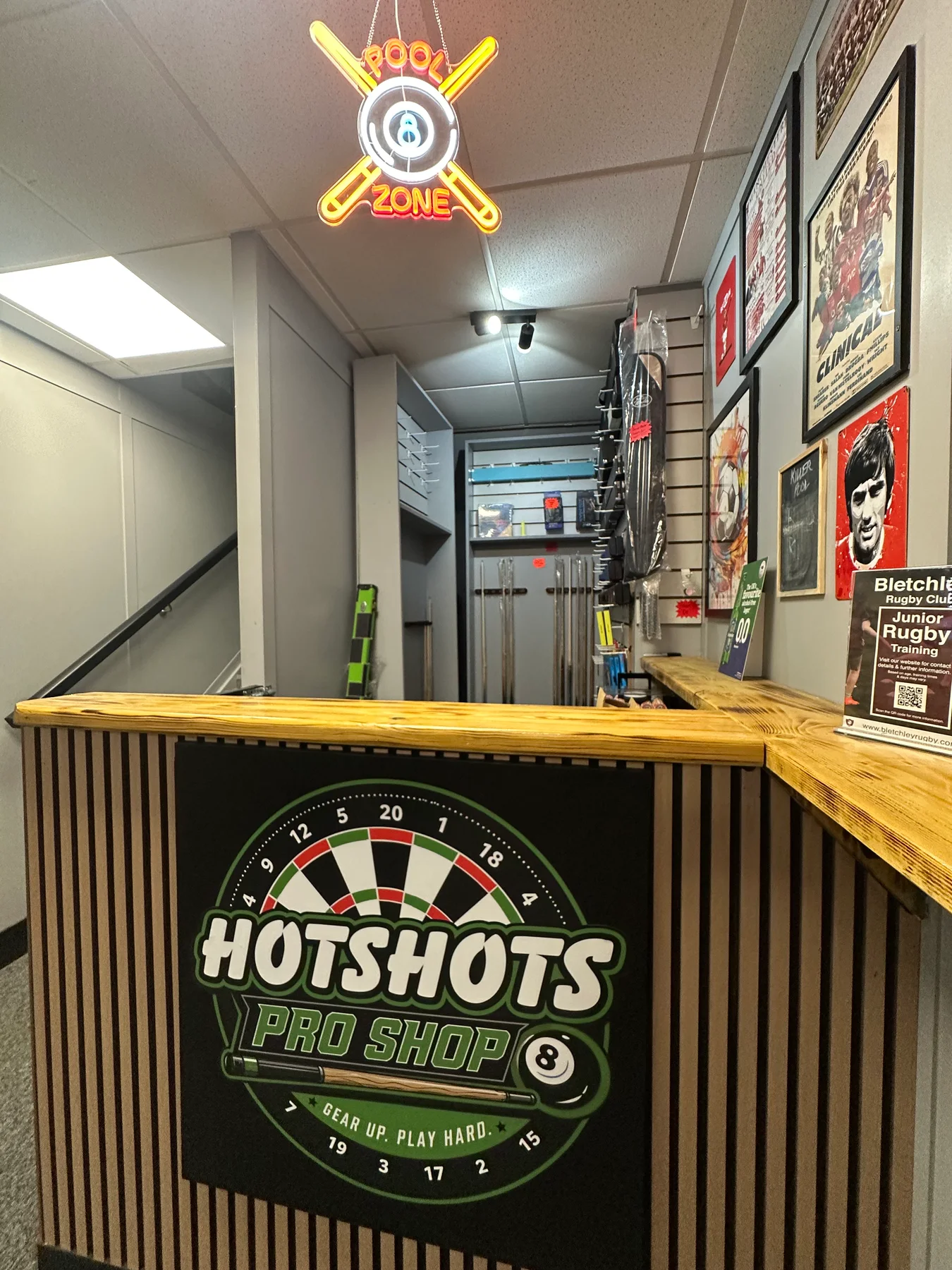The Pool Zone sign and Hotshots Pro Shop counter