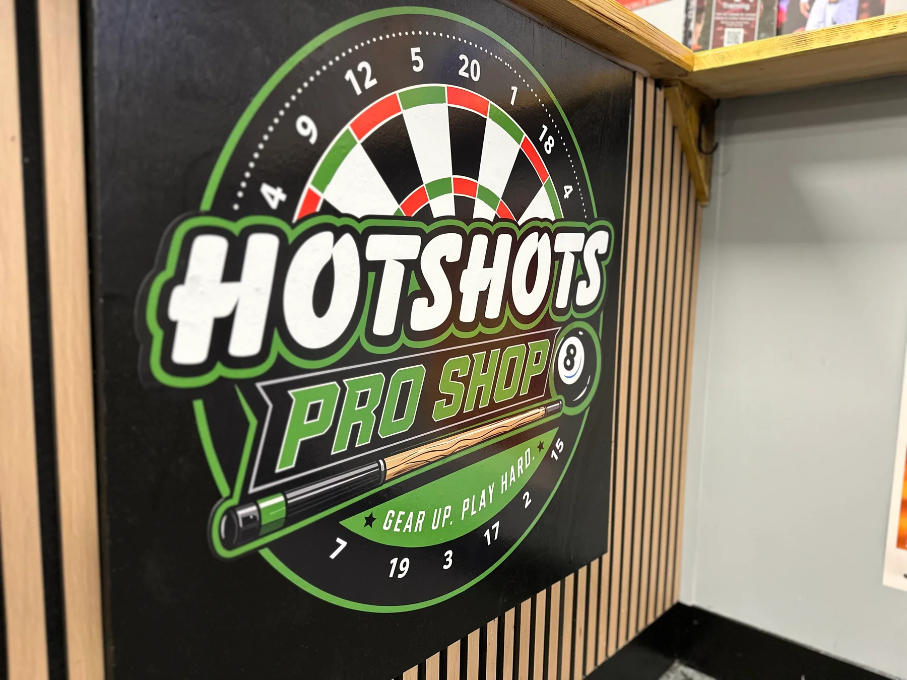 Hotshots Pro Shop sign inside the venue